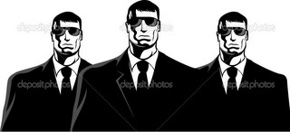 Three men in black suits. The secret service or mafia.